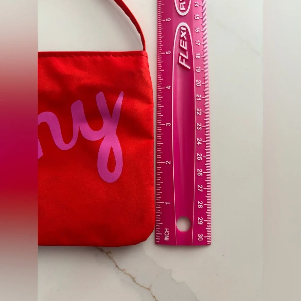 Kate Spade red nylon pouch with pink 